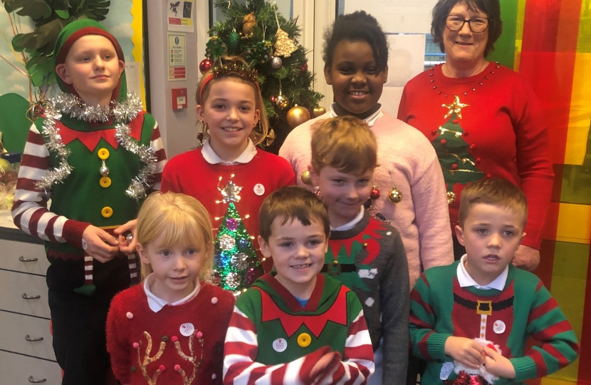 Pauline Latham OBE MP judges the Christmas jumper competition at Morley Primary School
