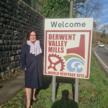 Pauline Latham OBE MP at Derwent Valley Mills sign